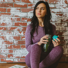 Load image into Gallery viewer, Woman enjoying matcha in a glass tumbler before a workout.