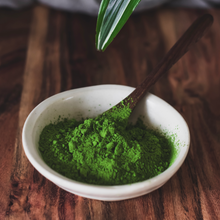 Load image into Gallery viewer, Ceremonial Matcha In white bowl with wood spoon,